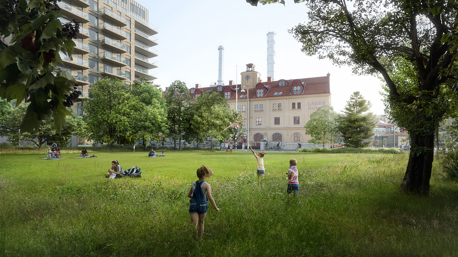 Visionsbild av grönområdet i Järnvågsparken på Masthuggskajen. Barn springer i gräset framför lagerhuset.